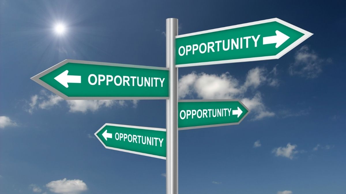 Chalkboard showing Opportunity ticked and Problem crossed out — representing the mindset shift for entrepreneurs starting over in a new country