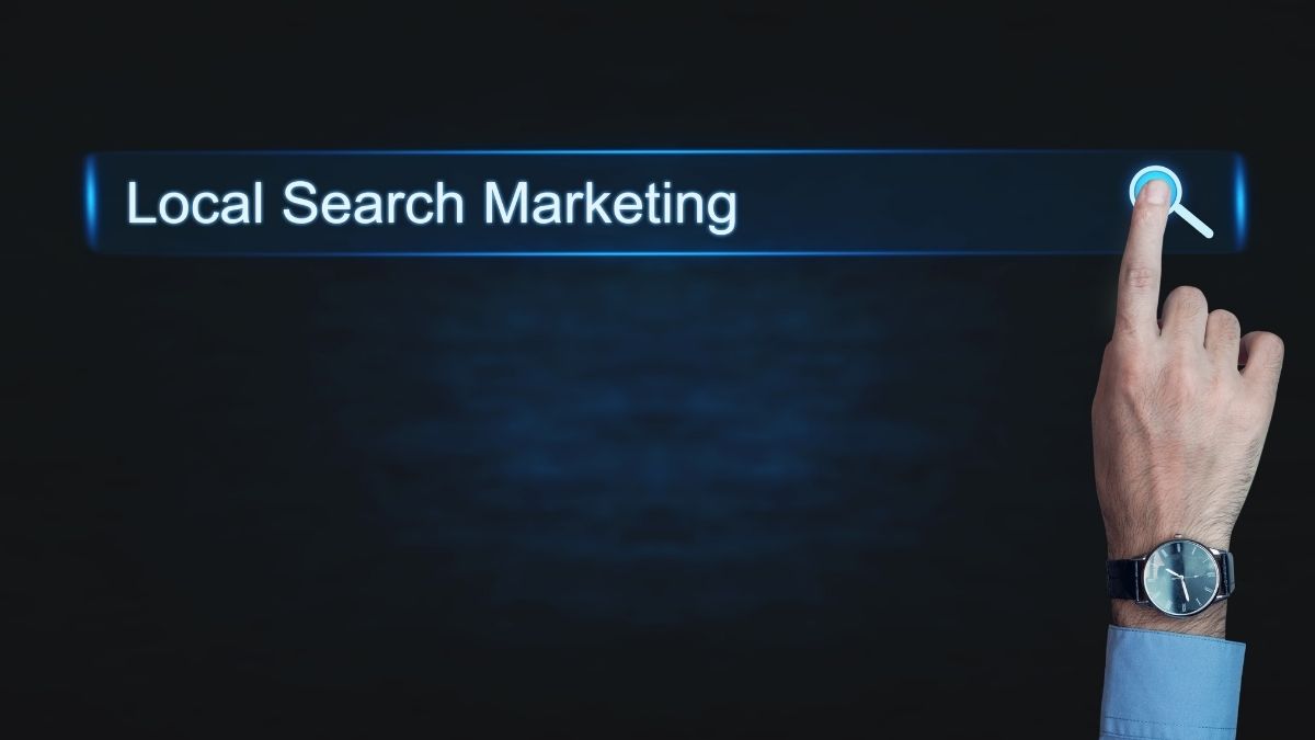 Hand pointing to a glowing Local Search Marketing search bar — representing SEO and getting found on Google